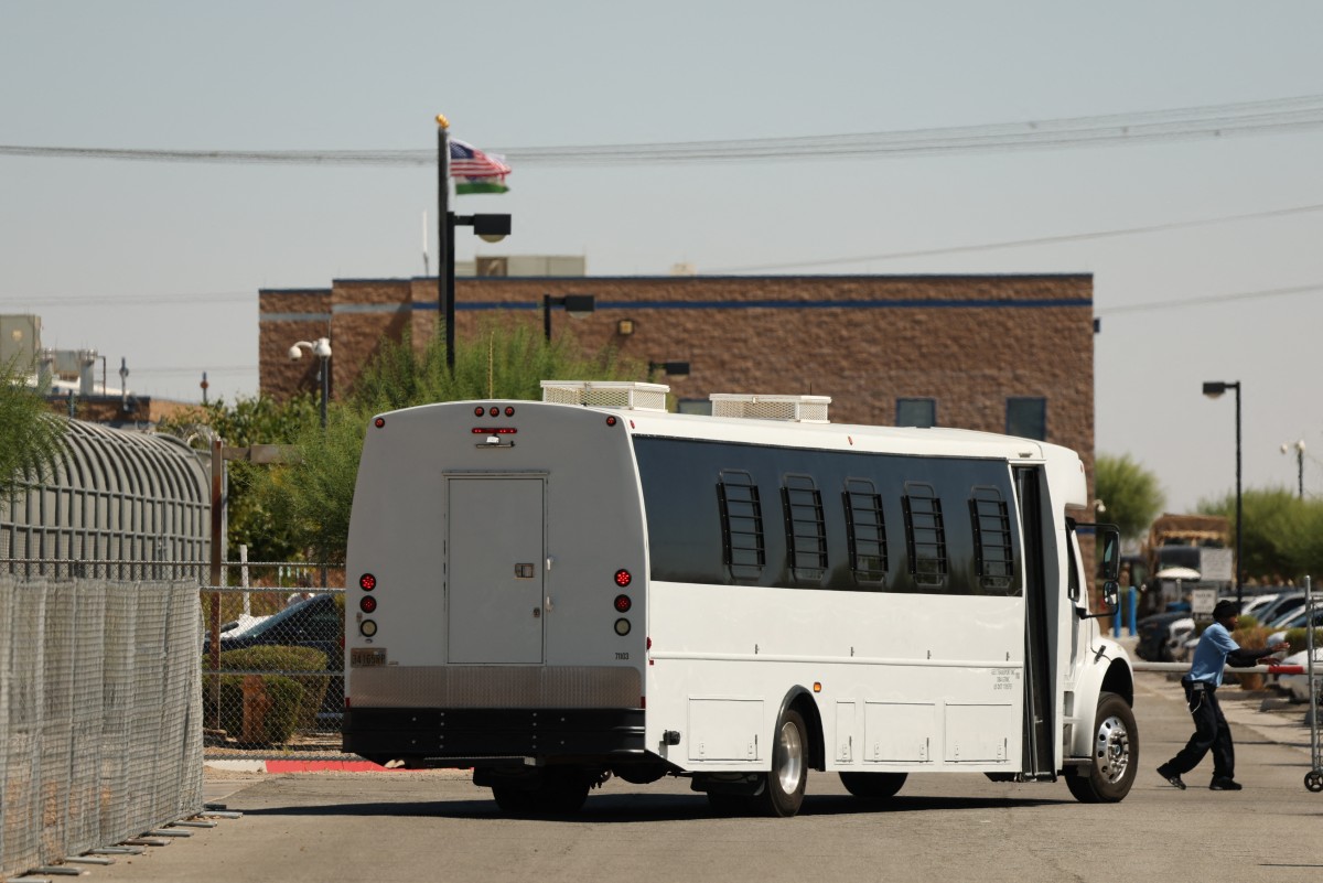 A shuttle bus transports detainees outside the private prison company GEO Group Adelanto ICE Processing Center detention facility in Adelanto, California, on July 11, 2025. (Photo by Patrick T. Fallon / AFP)