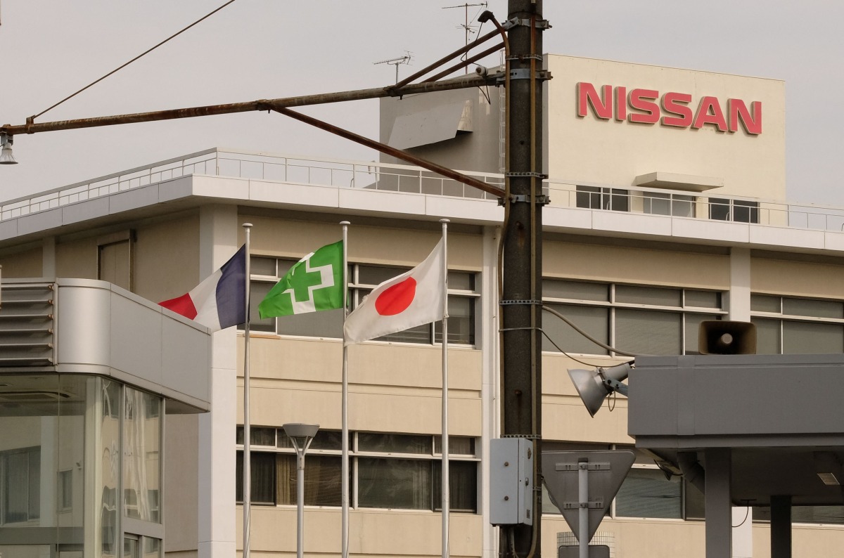 The national flags of France (L) and Japan (R) are displayed at an entrance of Japan's Nissan Motor's Oppama plant in Yokosuka, Kanagawa prefecture, on November 26, 2018. Photo by Kazuhiro NOGI / AFP