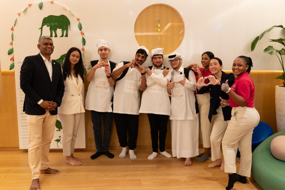 Children and caregivers from The Shafallah Center and Best Buddies with Raffles and Fairmont Doha staff.