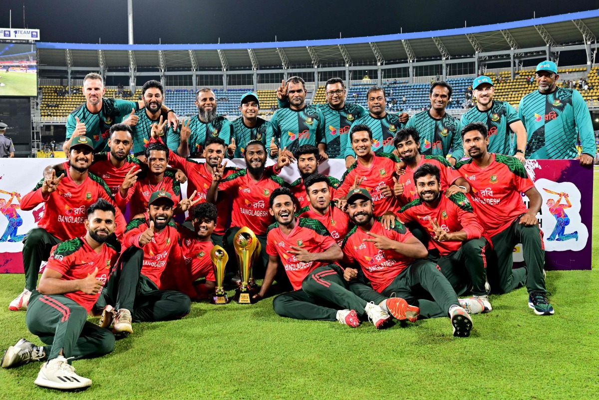 Bangladesh's players pose with the trophy after winning the Third and final Twenty20 international cricket match between Sri Lanka and Bangladesh at the R. Premadasa International Cricket Stadium in Colombo. Photo by Ishara S. KODIKARA / AFP