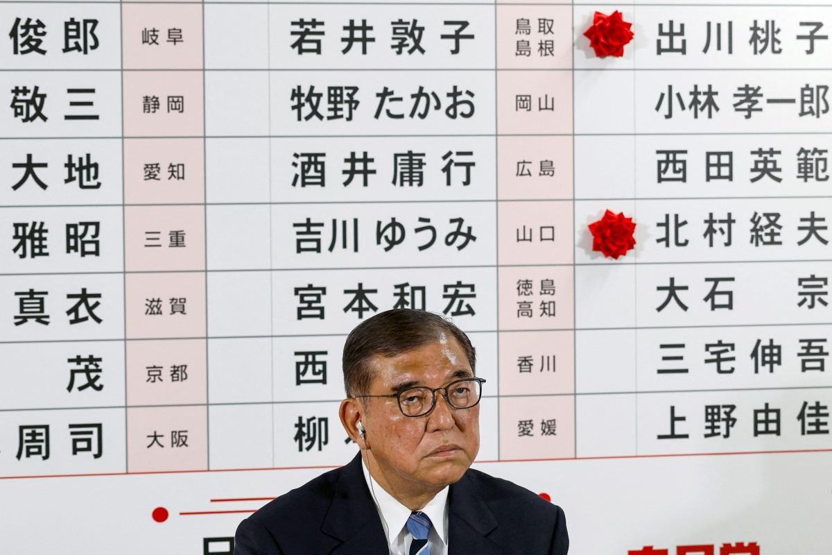 Japan's Prime Minister Shigeru Ishiba addresses the media at the vote counting centre in the Liberal Democratic Party (LDP) headquarters in Tokyo on July 20, 2025. (Photo by Franck ROBICHON / POOL / AFP)
