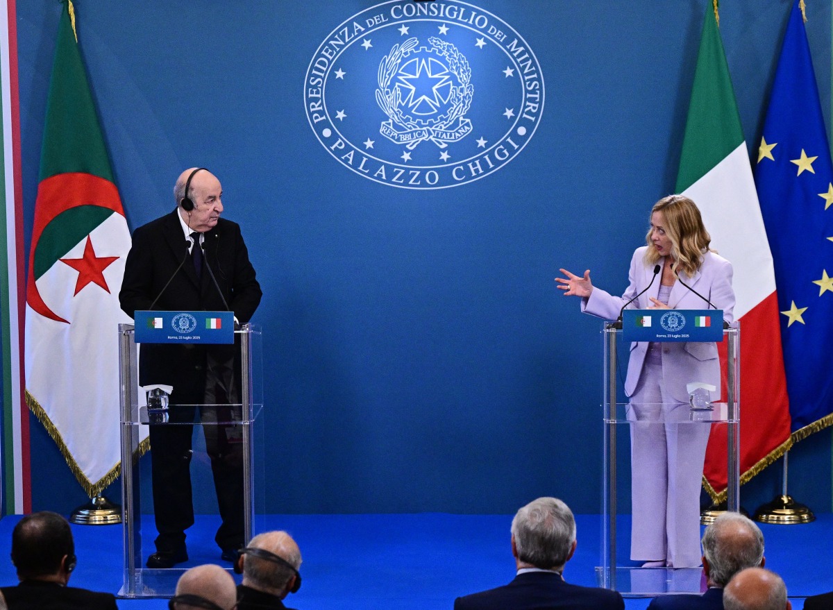 Italy's Prime Minister Giorgia Meloni (R) addresses a joint press conference with Algeria's President Abdelmadjid Tebboune (L) during a summit at the Villa Doria Pamphili in Rome on July 23, 2025. (Photo by Tiziana FABI / AFP)
