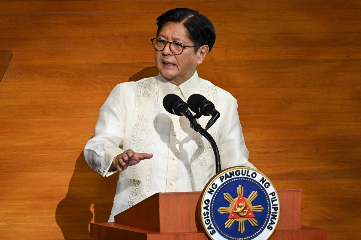 Philippine President Ferdinand Marcos delivers his speech during the State of the Nation Address at the House of Representatives in Manila on July 28, 2025. (Photo by Ted ALJIBE / AFP)
