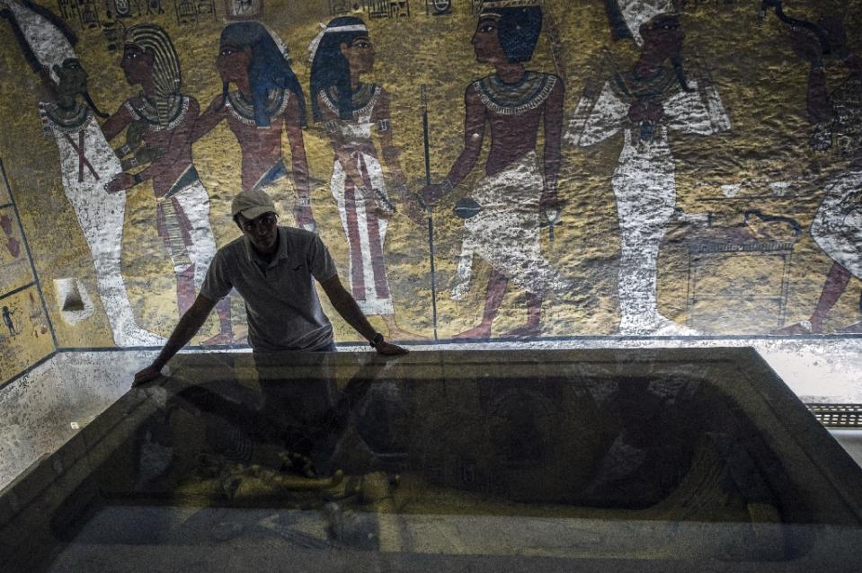Representational file photo showing an Egyptian archaeologist looks at the sarcophagus of King Tutankhamun in his burial chamber in the Valley of the Kings, close to Luxor.
