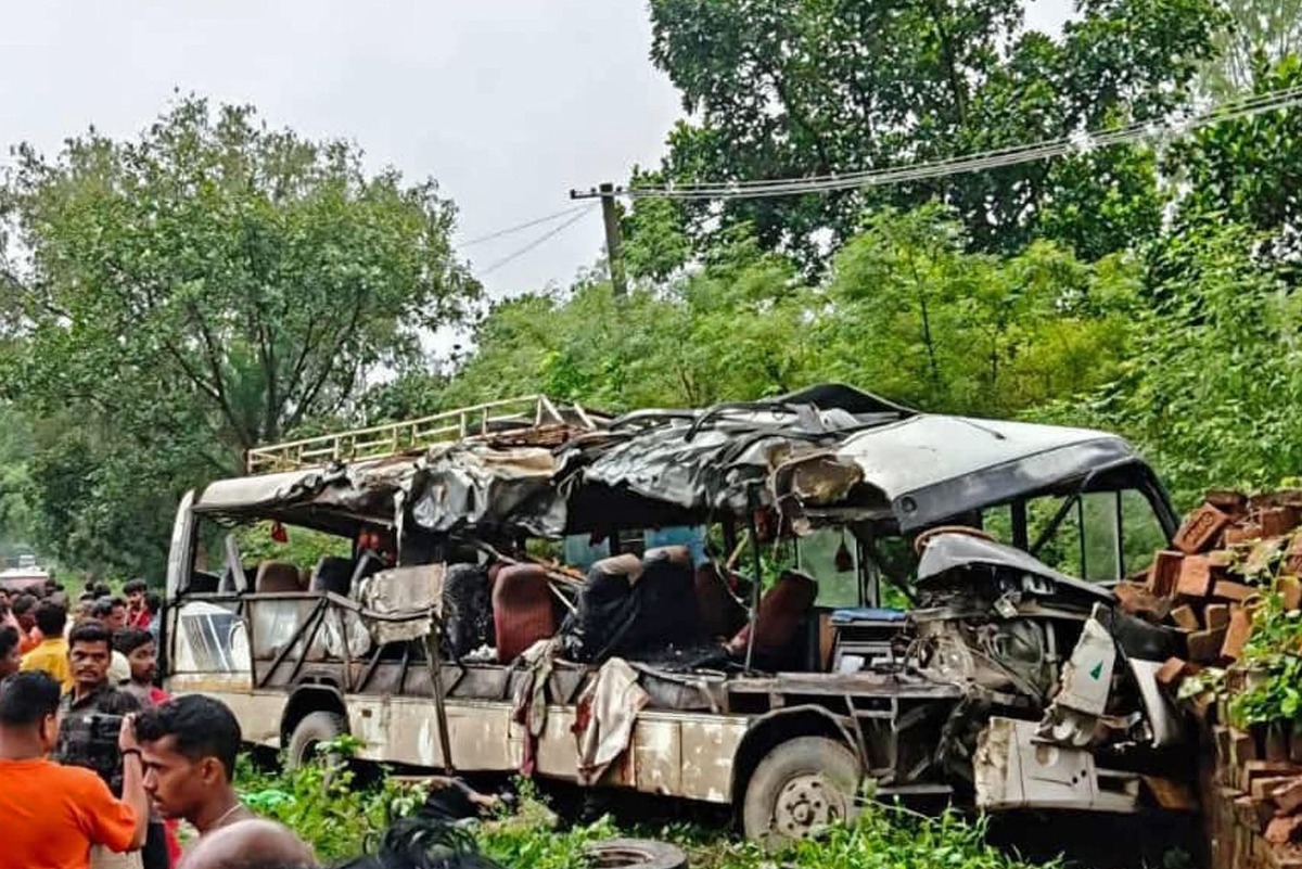 People gather near a wrecked bus at the site of a road accident in the Deoghar district of India's Jharkhand state on July 29, 2025. Photo by AFP