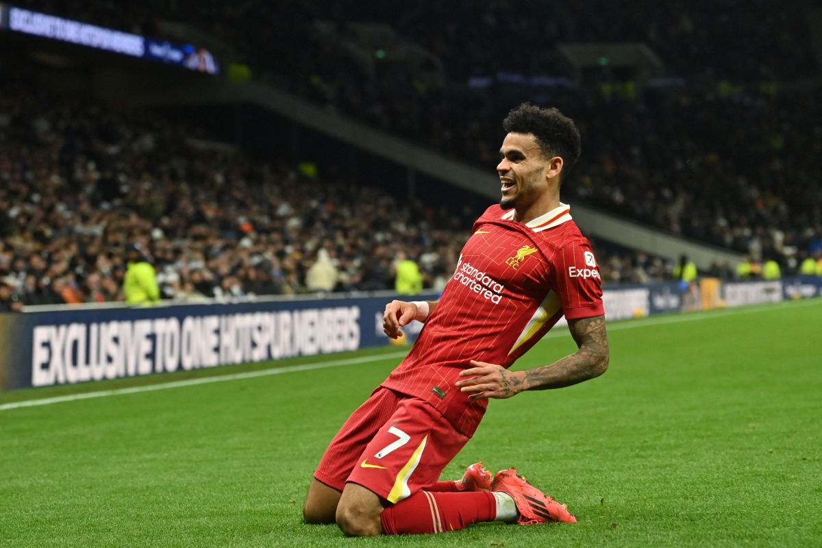 Liverpool's Colombian midfielder #07 Luis Diaz celebrates after scoring their sixth goal during the English Premier League football match between Tottenham Hotspur and Liverpool at the Tottenham Hotspur Stadium in London, on December 22, 2024. Photo by Glyn KIRK / AFP