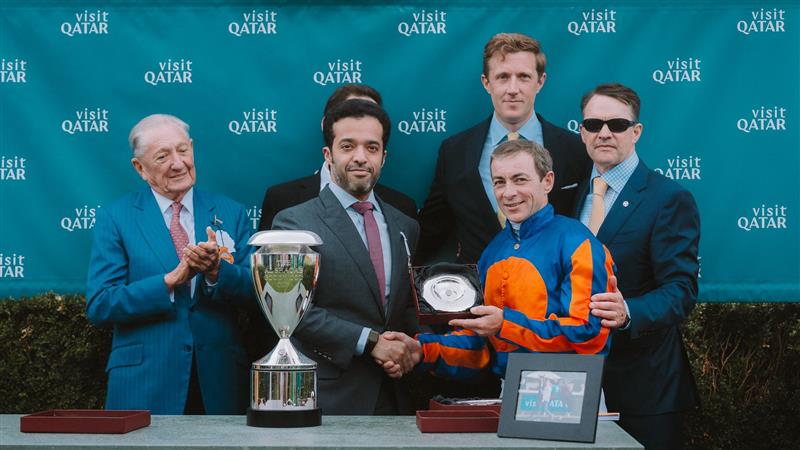 Chairman of Qatar Tourism and Chair of the Board of Directors of Visit Qatar H E Saad Bin Ali Al Kharji (second left) presenting a trophy to one of the winners.