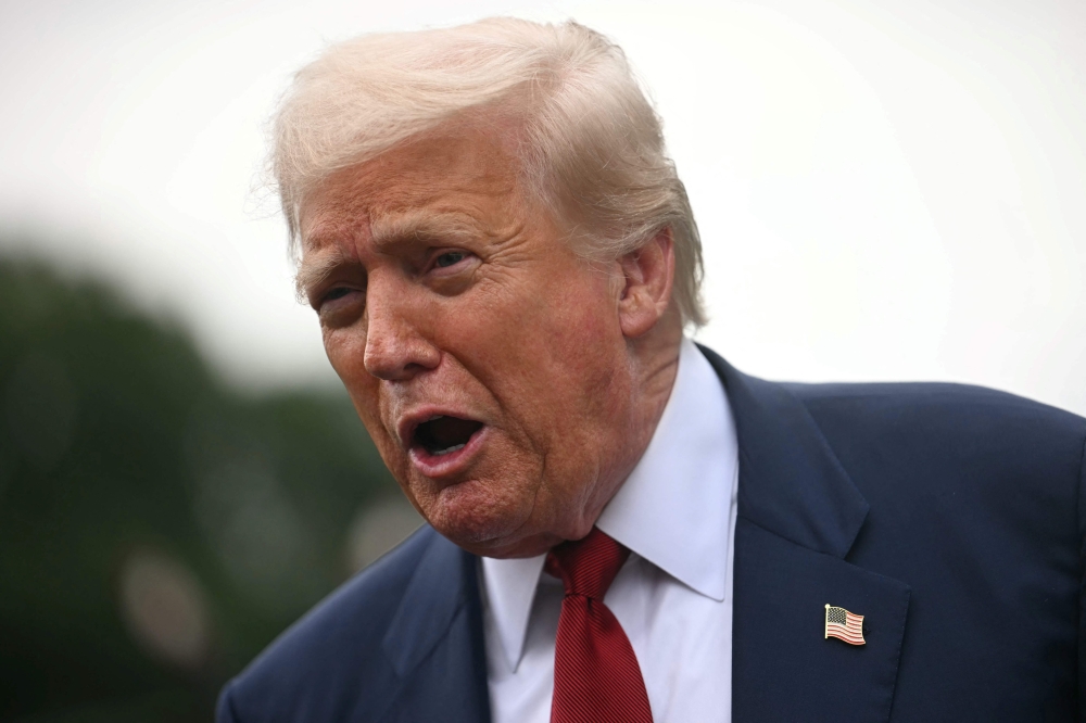 US President Donald Trump speaks to the press before boarding Marine One on the South Lawn of the White House in Washington, DC, on August 1, 2025. (Photo by Jim Watson / AFP)
