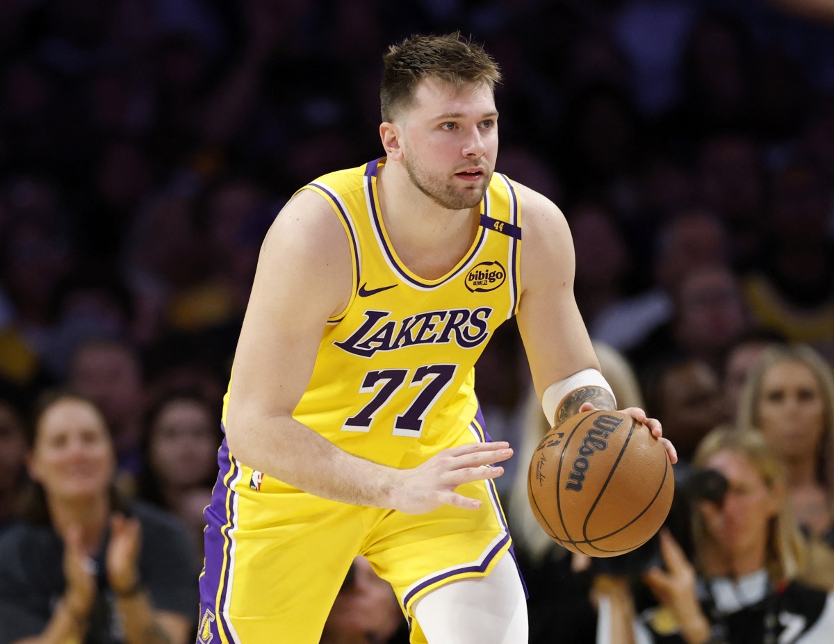 Luka Doncic #77 of the Los Angeles Lakers dribbles during a 103-96 loss to the Minnesota Timberwolves in Game Five of the Western Conference First Round NBA Playoffs at Crypto.com Arena on April 30, 2025 in Los Angeles, California. (Photo by Harry How / GETTY IMAGES NORTH AMERICA / AFP)
