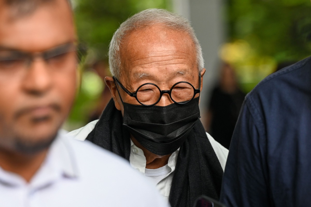 Malaysian hotel tycoon Ong Beng Seng (C) leaves the State Court in Singapore on August 4, 2025. Photo by Roslan RAHMAN / AFP