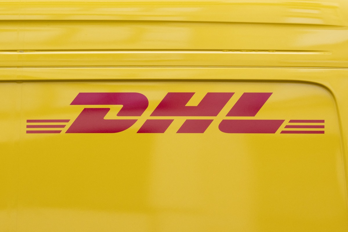 This photograph shows the logo of DHL, a US founded multinational courier company, in Paris on July 30, 2025. (Photo by Martin LELIEVRE / AFP)
