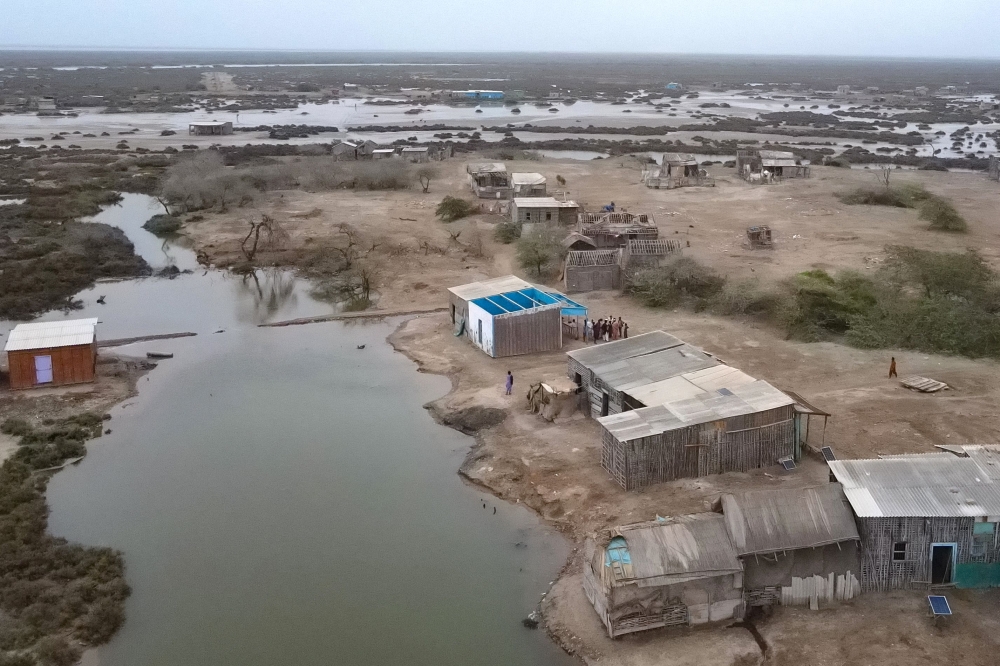 In this aerial photograph taken on June 25, 2025, abandoned houses are pictured in one of the villages of Kharo Chan town, in the Indus delta, south of Pakistan. (Photo by Israr Ahmed Khan / AFP) 