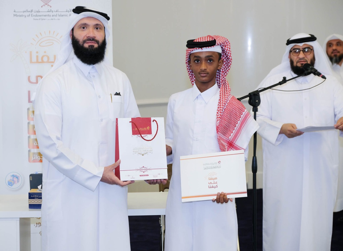 Officials present an award to a participant.