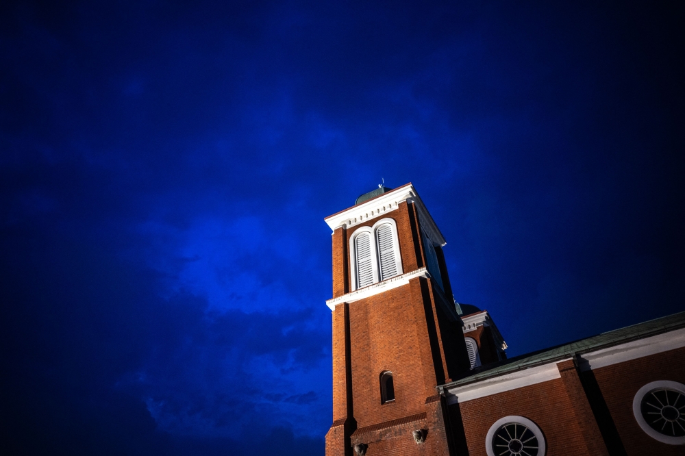 This picture taken on August 7, 2025 shows a general view of Urakami Cathedral's bell towers in Nagasaki city. (Photo by Philip Fong / AFP) 
