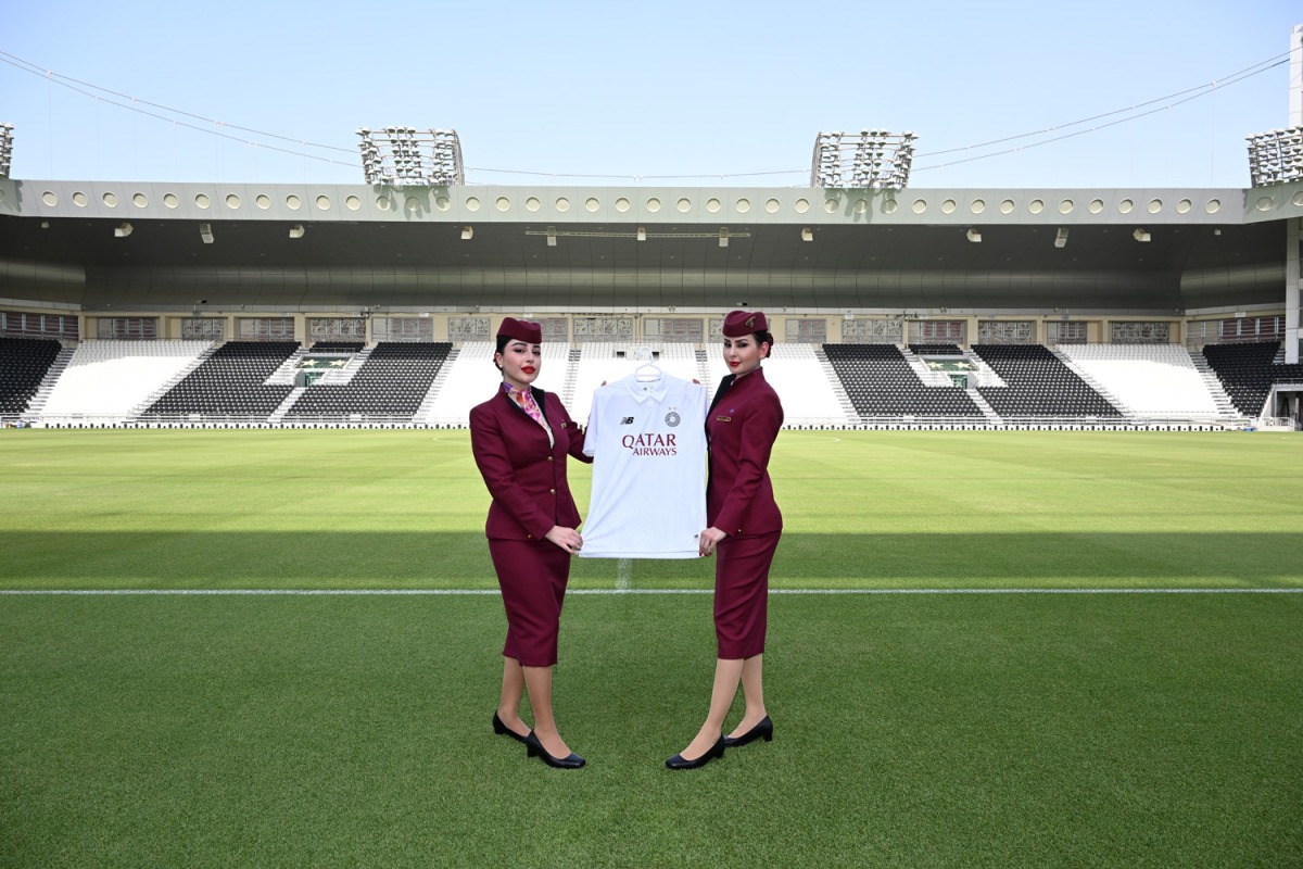Qatar Airways staff with the new Al Sadd Sports Club jersey.