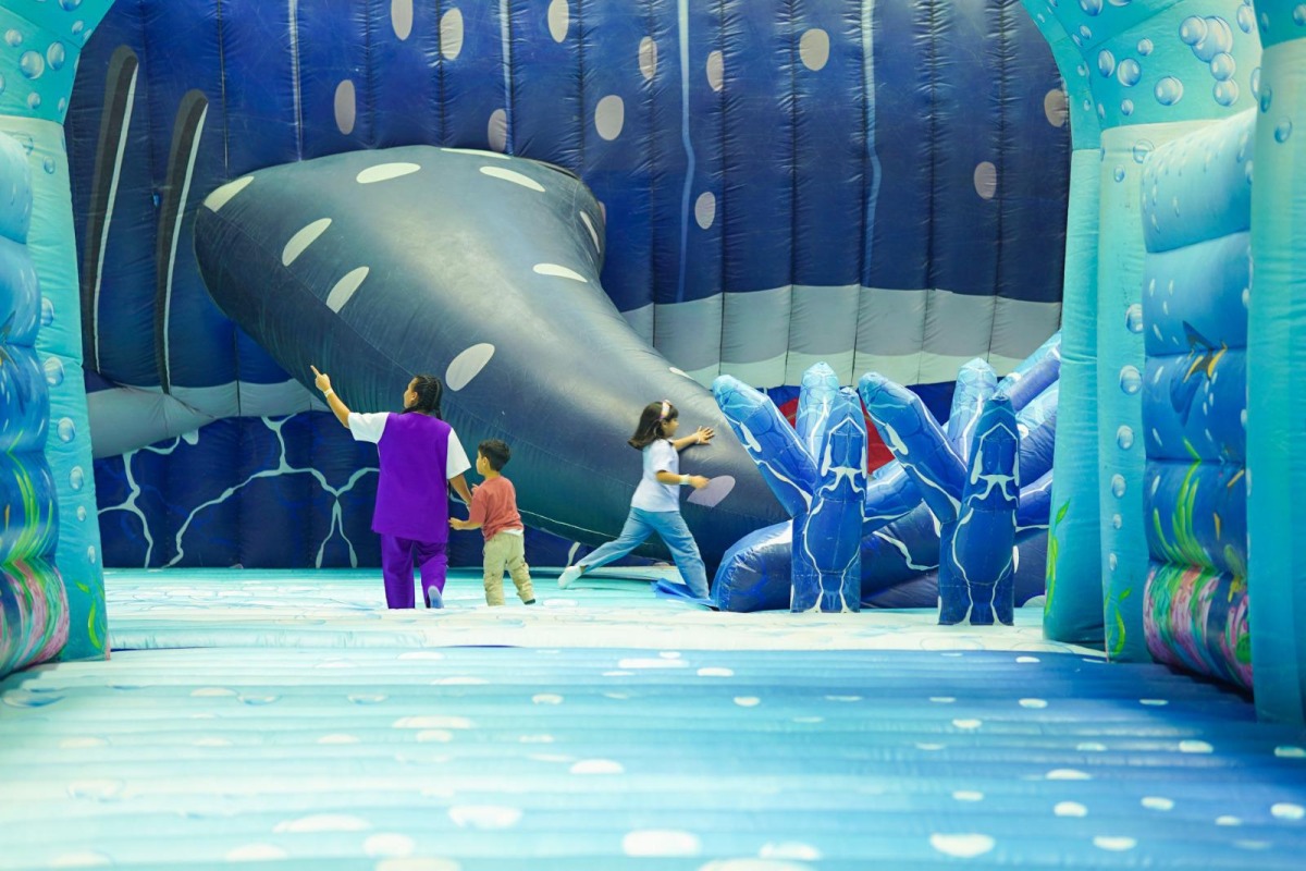 Children play at InflataCity 2025, being held at QNCC until August 28.