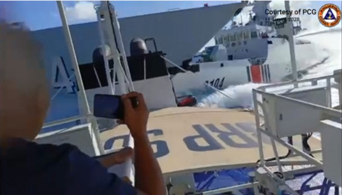 This handout video grab released and taken on August 11, 2025 by the Philippine Coast Guard shows an incident between a Chinese Navy vessel (L) and a Chinese Coast Guard ship (R) as seen from a Philippine fisheries boat near Scarborough Shoal in the disputed South China Sea. Photo by Handout / Philippine Coast Guard (PCG) / AFP