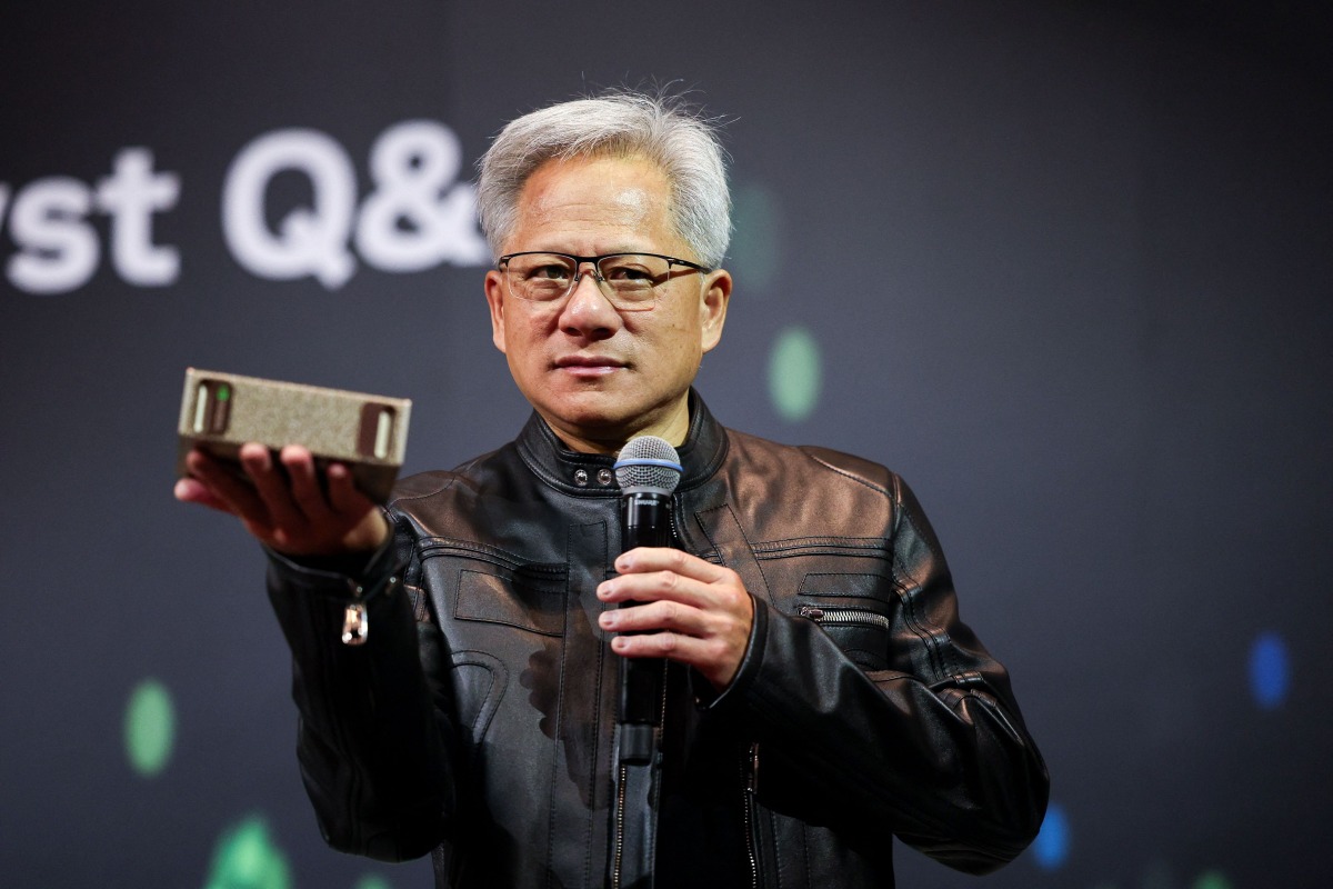 (FILES) Jensen Huang, co-founder and CEO of Nvidia Corp., speaks during a news conference in Taipei on May 21, 2025. (Photo by I-Hwa Cheng / AFP)

