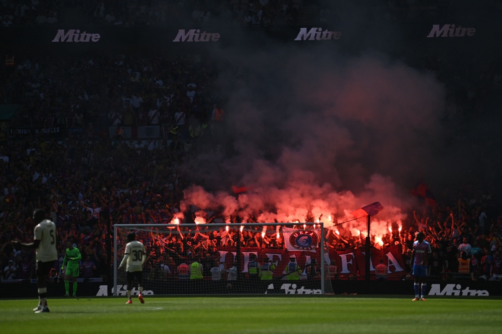 Crystal Palace fans hold a protest against UEFA as the game starts during the English FA Community Shield football match between Crystal Palace and Liverpool at Wembley Stadium, in London on August 10, 2025. (Photo by Glyn KIRK / AFP)