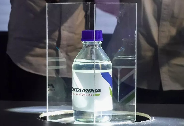 A sample of Pertamina's sustainable aviation fuel made from a mix of used cooking oil is presented during a news conference at a Pertamina refinery in Cilacap, Central Java, on  August 12, 2025. Photo credit: Idhad Zakaria/Antara/social media