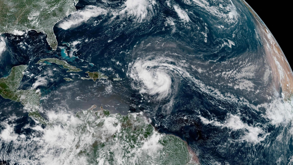 This satellite image provided by the National Oceanic and Atmospheric Administration (NOAA) shows Hurricane Erin forming in the Atlantic Ocean on August 15, 2025. (Photo by Handout / NOAA / AFP) 