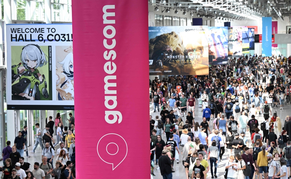 (Files) A photo shows visitors at the Gamescom video games trade fair in Cologne, western Germany on August 22, 2024. (Photo by Ina Fassbender / AFP)