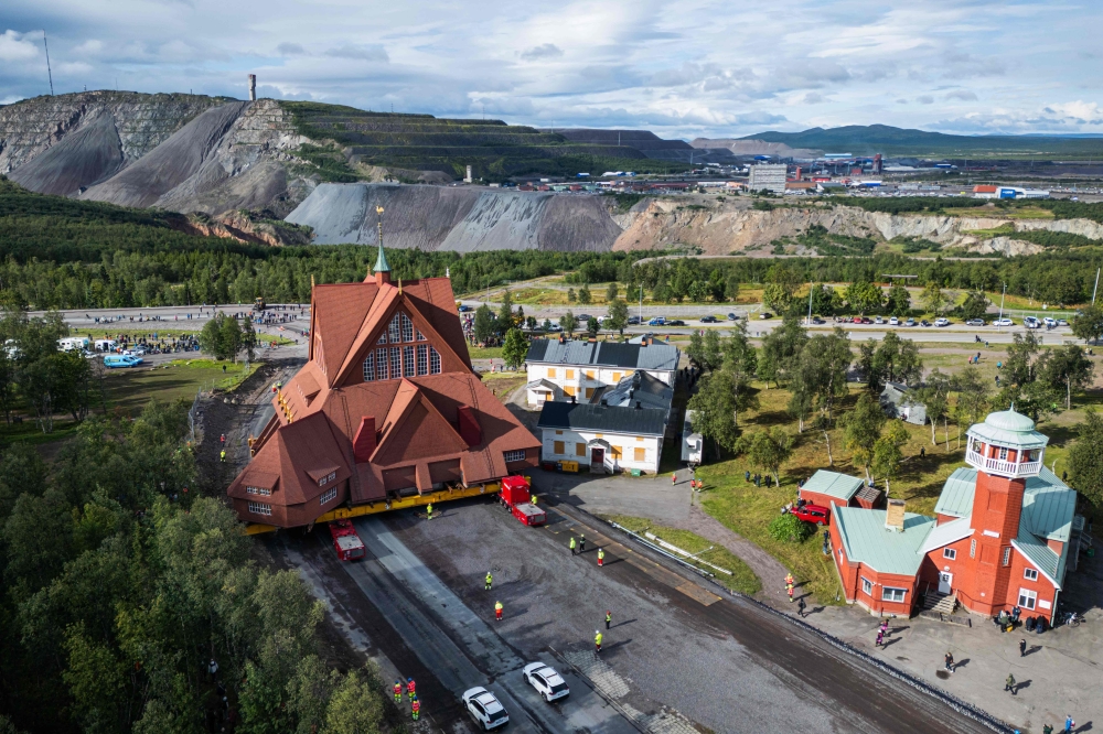 The wooden Kiruna Church is transferred to its new location, in Kiruna, Sweden on August 19, 2025. (Photo by Jonathan NACKSTRAND / AFP)
 