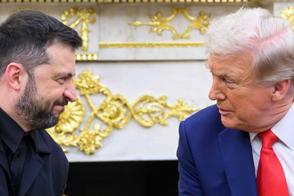 US President Donald Trump and Ukraine President Volodymyr Zelensky take part in a bilateral meeting in the Oval office of the White House in Washington, DC on August 18, 2025. (Photo by Mandel Ngan / AFP)
