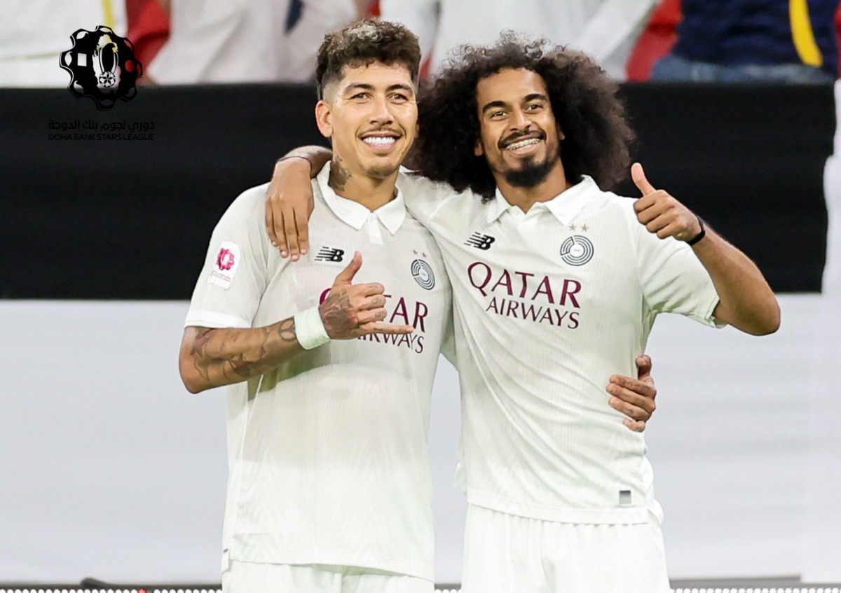 Al Sadd’s Akram Afif (right) celebrates with teammate Roberto Firmino after scoring the team’s second goal.