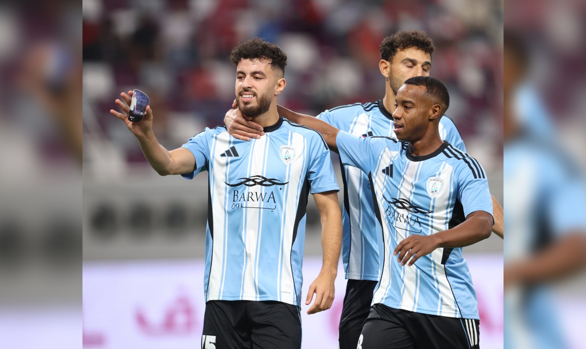 Al Wakrah’s Amine Zouhzouh (left) celebrates with teammates after converting a penalty against Al Duhail.  