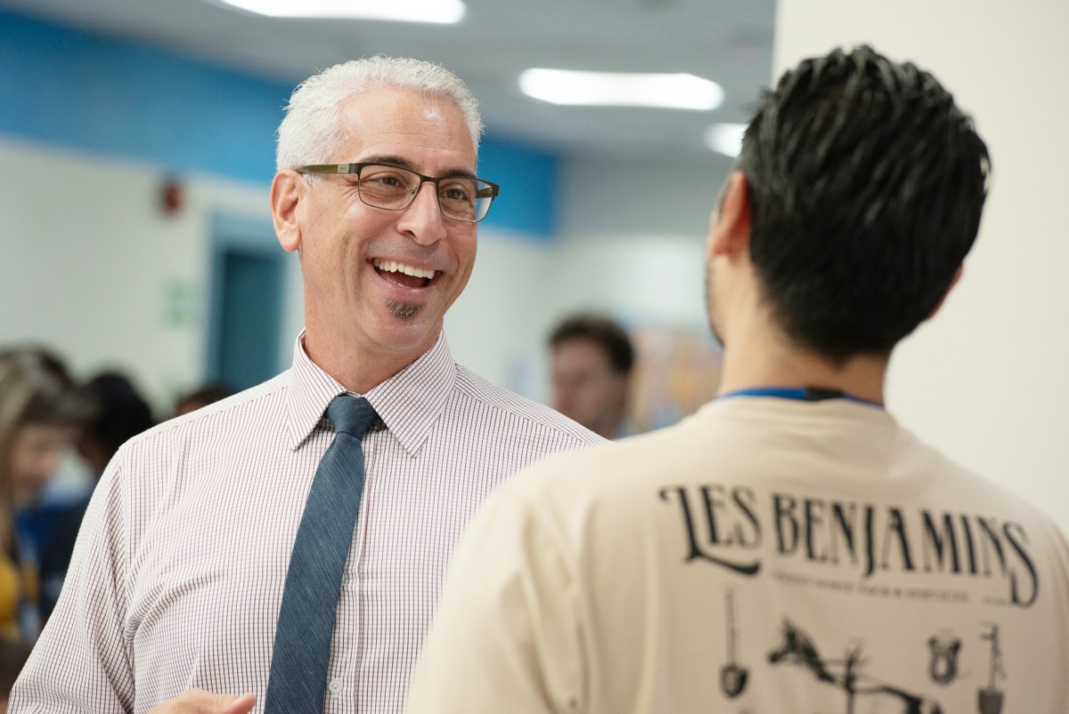 Dr. Guthrie welcomes families on the first day of school
