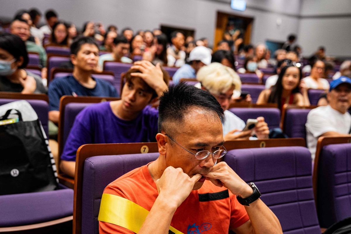 A participant practises his bird calls during the Hong Kong Bird Watching Society’s bird call competition at the University of Hong Kong on August 23, 2025. Photo by Leung Man Hei / AFP