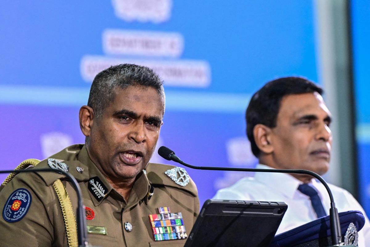 Sri Lanka's Inspector General of Police Priyantha Weerasooriya (L) speaks as Minister of Public Security Ananda Wijepala looks on during a press conference in Colombo on August 28, 2025. Photo by Ishara S. KODIKARA / AFP