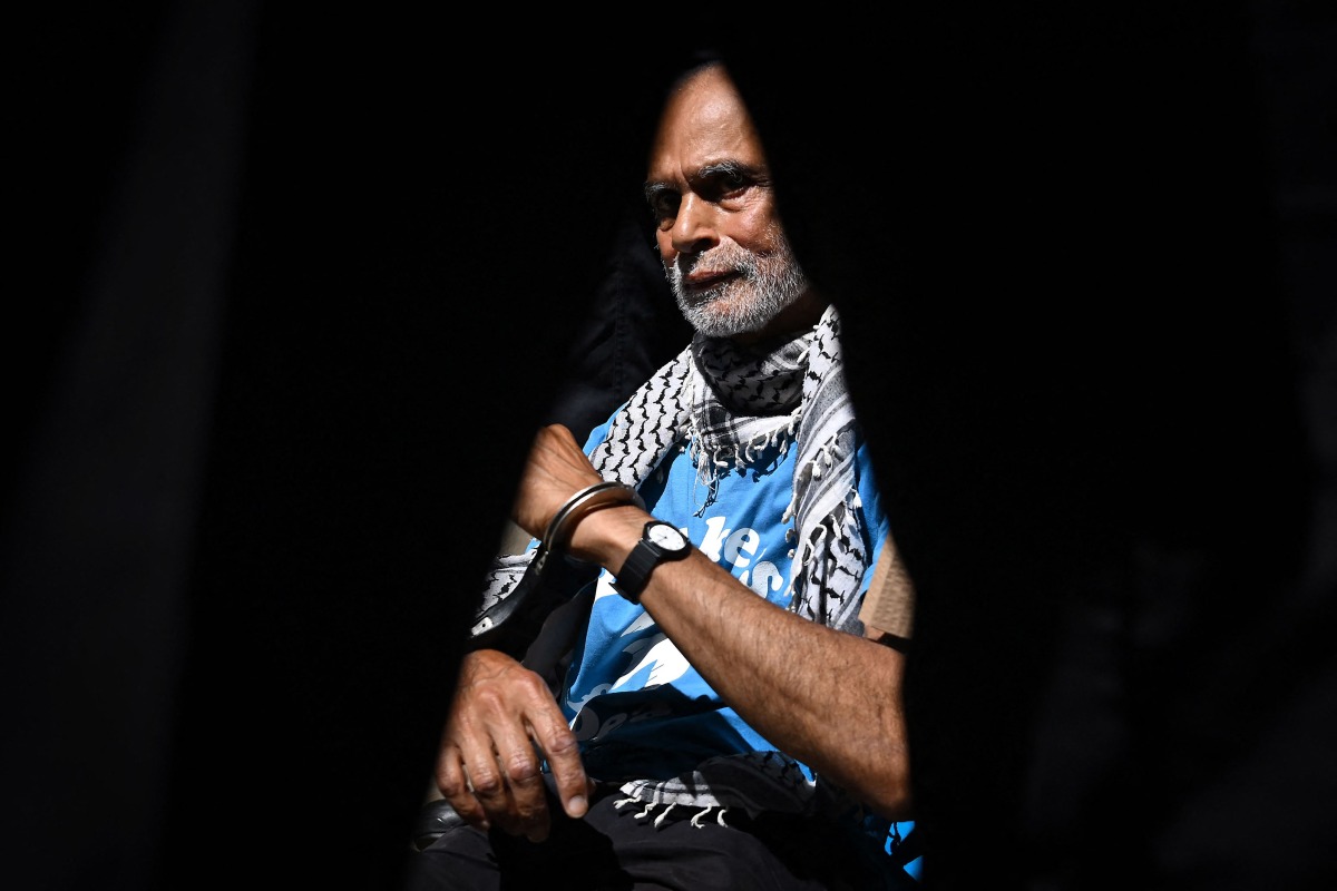 File photo: A protester is pictured in handcuffs through a police officers legs before being carried away after being arrested as people gather in support of the pro-palestinian group 
