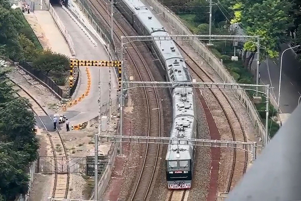 This frame grab made from AFPTV video footage taken on September 2, 2025 shows a train believed to be carrying leader Kim Jong Un approaching Beijing Railway Station in Beijing. (Photo by Agatha Cantrill / AFPTV / AFP)