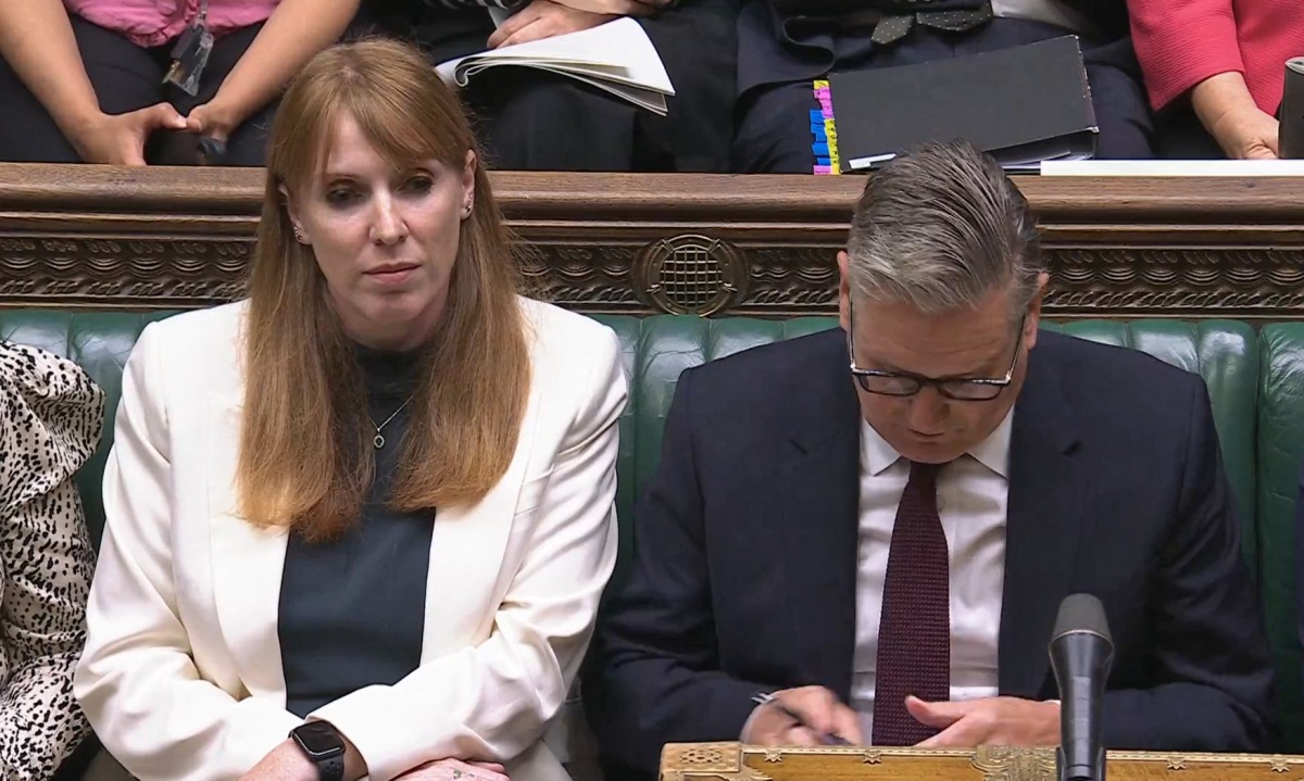 A video grab from footage broadcast by the UK Parliament's Parliamentary Recording Unit (PRU) shows Britain's Prime Minister Keir Starmer sits alongside Britain's Deputy Prime Minister and Levelling Up, Housing and Communities Secretary Angela Rayner during the weekly session of Prime Minister's Questions (PMQs) in the House of Commons in London, on September 3, 2025. (Photo by PRU / AFP)