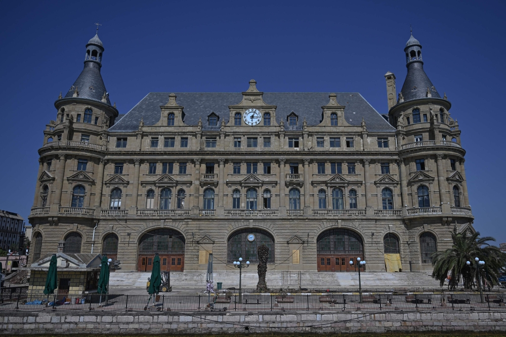 This photograph shows the historical Haydarpasa train station building at Kadikoy in Istanbul, on August 24, 2025. (Photo by Ozan Kose / AFP)