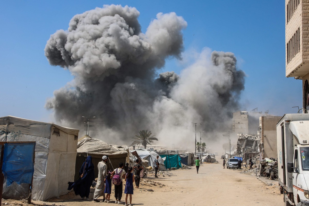 Smoke billows during Israeli strikes on the Mushtaha Tower in Gaza City on September 5, 2025, amid the war between Israel and the Hamas militant movement. (Photo by Omar AL-QATTAA / AFP)
