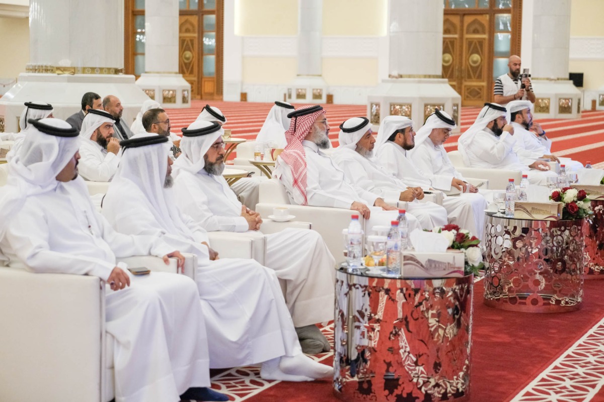 Minister of Awqaf and Islamic Affairs H E Ghanem bin Shaheen bin Ghanem Al Ghanim with other officials during the event.
