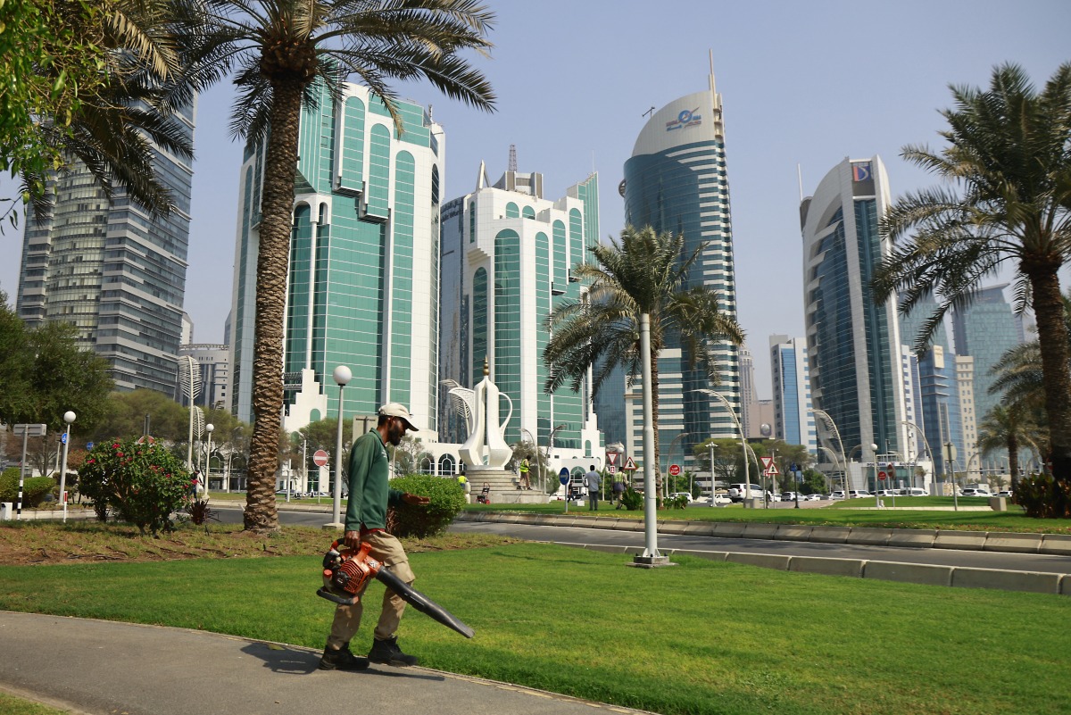 A municipal worker cleans a square in Qatar's capital Doha on September 10, 2025. Photo by Karim JAAFAR / AFP