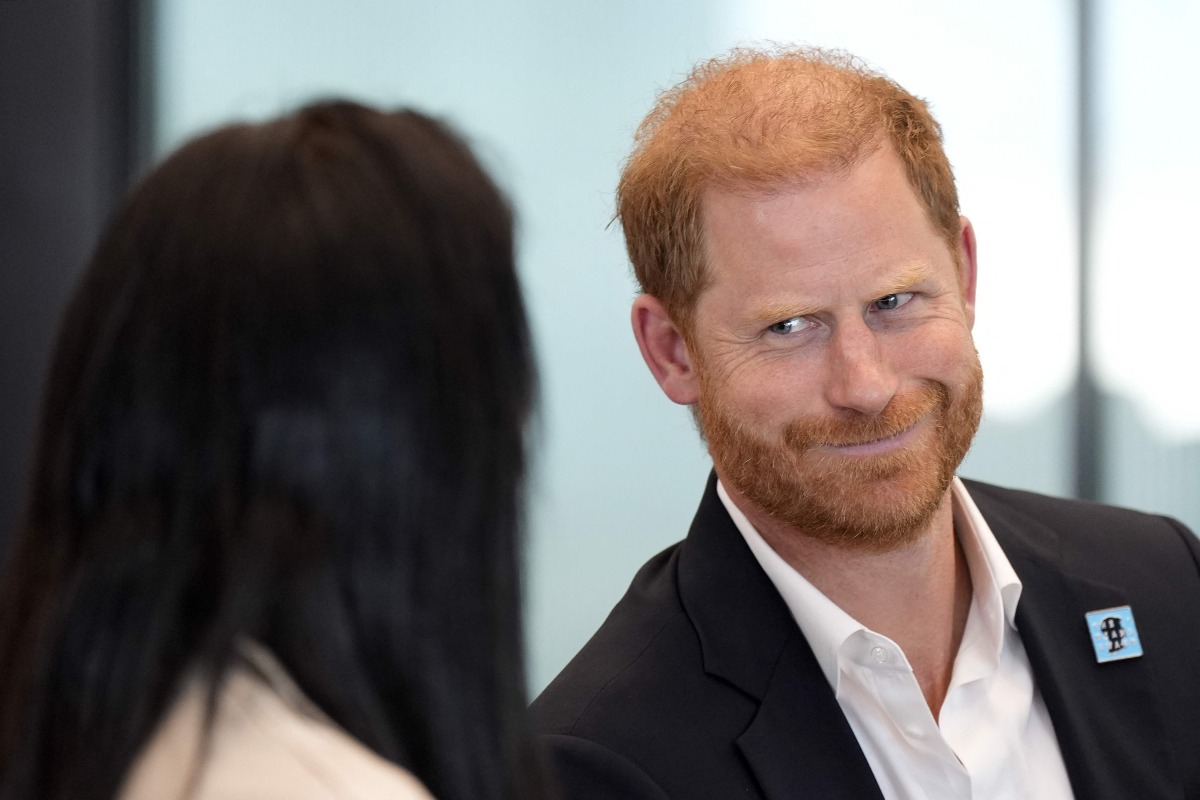 Britain's Prince Harry, Duke of Sussex, reacts as he takes part in a panel discussion on how social action positively impacts mental health, with four young people who are involved with The Diana Award, in central London on September 11, 2025. (Photo by Aaron Chown / POOL / AFP)