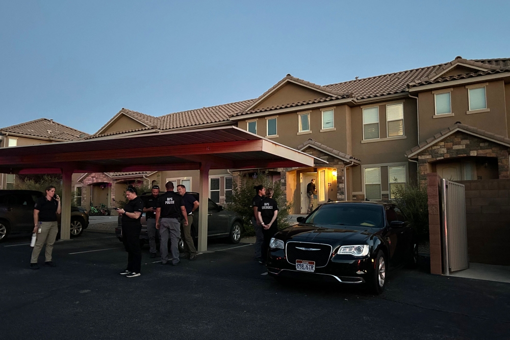 Forensic agents are seen at the apartment complex where Tyler Robinson lives in St. George, Utah, on September 12, 2025. (Photo by Romain Fonsegrives / AFP)
 