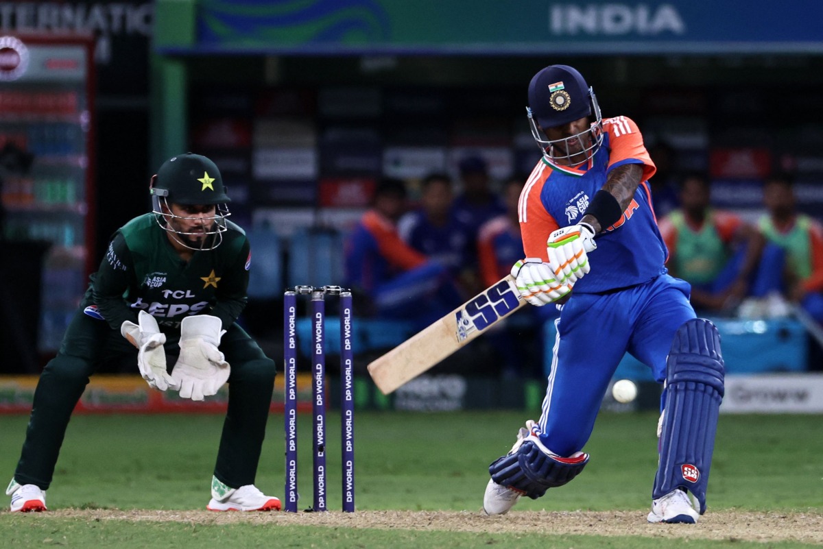India's captain Suryakumar Yadav plays a shot during the Asia Cup 2025 Twenty20 international cricket match between India and Pakistan at the Dubai International Stadium in Dubai on September 14, 2025. (Photo by Fadel SENNA / AFP)
