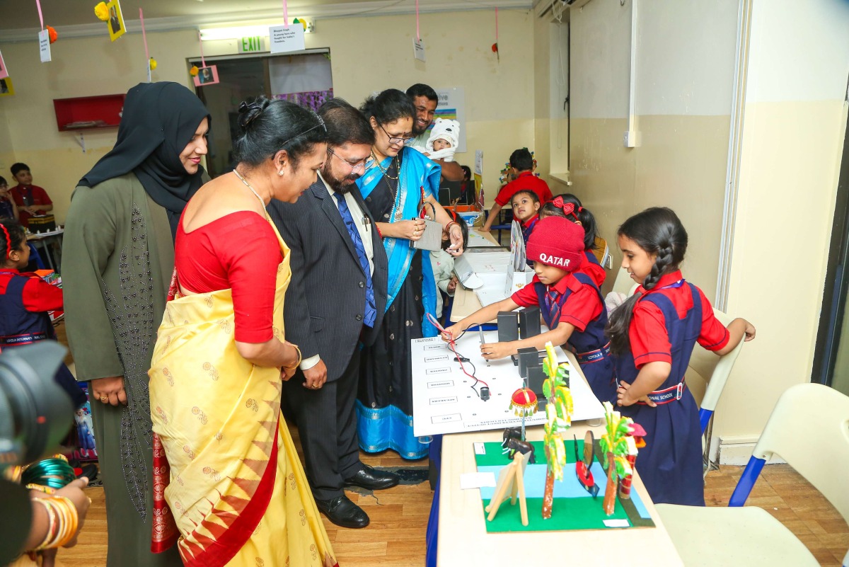 School officials and guests visiting a stall set up by the students