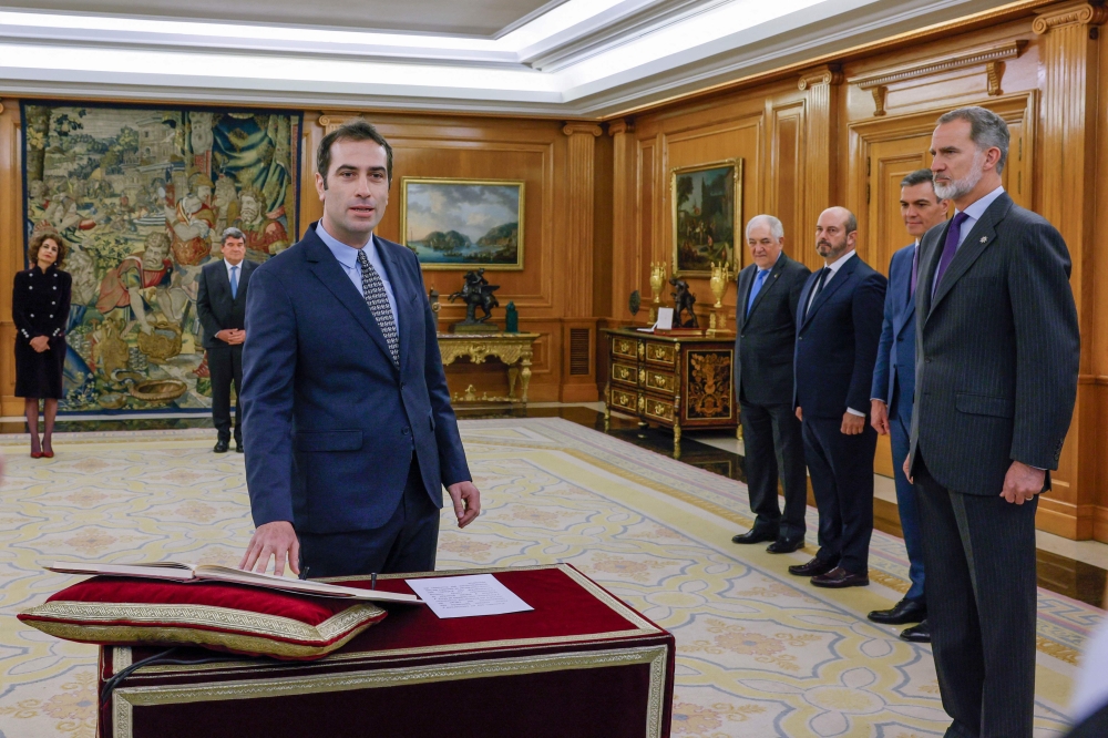 File photo: Newly appointed Spain's Economy Minister Carlos Cuerpo swears on the constitution in front of Spain's King Felipe VI during a ceremony at la Zarzuela Palace in Madrid, on December 29, 2023. (Photo by Andres Ballesteros / POOL / AFP)

