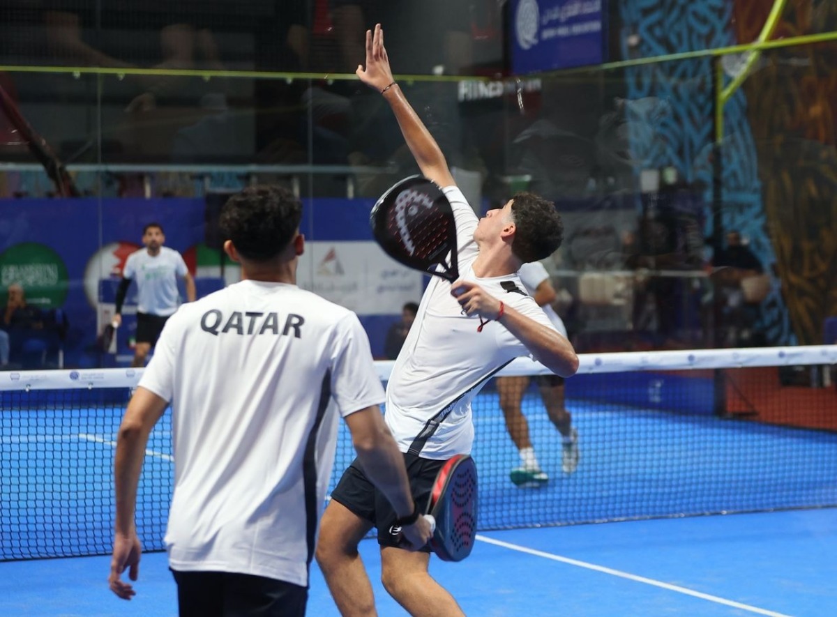 Qatar players in action against Saudi Arabia.