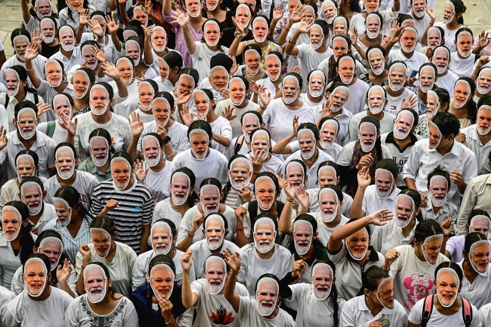 Students wear masks of India's Prime Minister Narendra Modi to celebrate his 75th birthday, in Chandigarh on September 17, 2025. (Photo by AFP)
