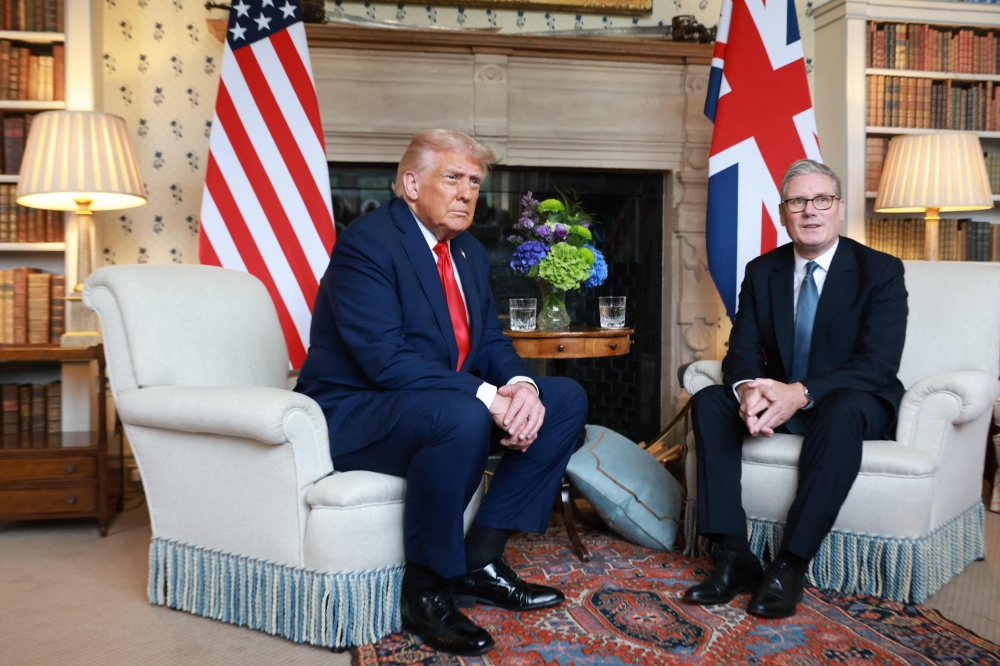 Britain's Prime Minister Keir Starmer and US President Donald Trump sit down for a bilateral meeting at Chequers, in Aylesbury, central England, on September 18, 2025. (Photo by Ian Vogler / POOL / AFP)
