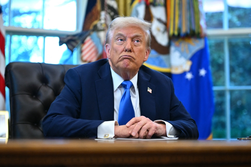 US President Donald Trump speaks before signing executive orders in the Oval Office at the White House in Washington, DC, on September 19, 2025. (Photo by Mandel Ngan / AFP)