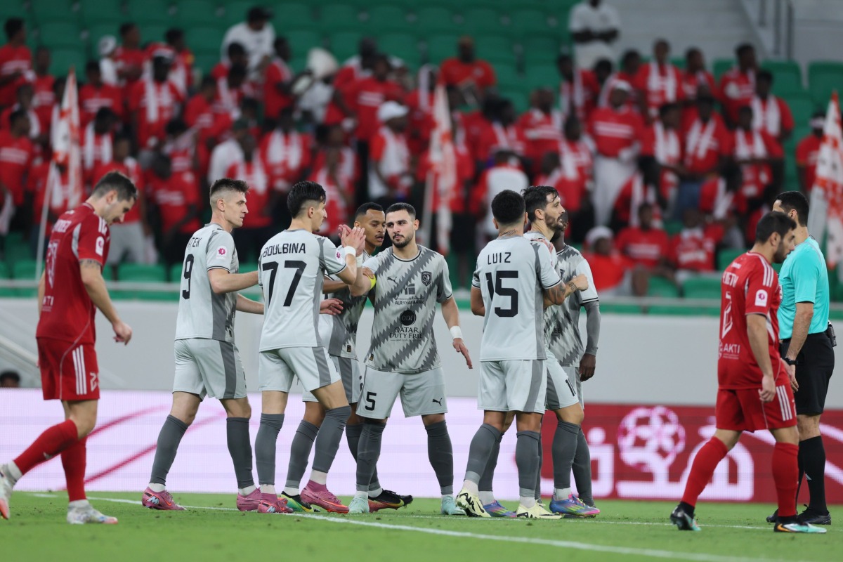 Al Duhail's Adil Boulbina (third left) celebrates with teammates.